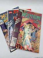 Stack of four bagged Wolverine comics showing covers