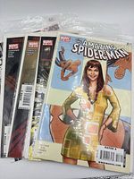 Group of five bagged Amazing Spider-Man comics fanned out