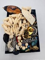 Top view of entire box showing assorted jewelry pieces