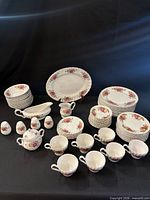 full set overview showing plates, cups, platter, gravy boat, sugar bowl and shakers