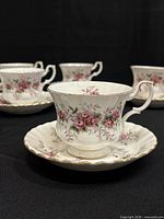 Group view of Royal Albert teacups and saucers showing pattern