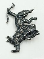 Front view of sterling silver Siam dancer brooch