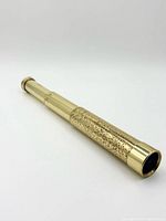 Side view of brass spyglass telescope fully closed