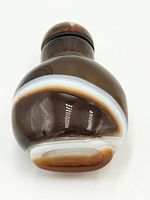 Front view showing banded agate pattern and stopper