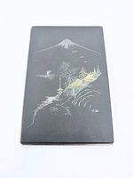front of case showing gold and silver damascene Mt Fuji scene