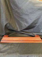 front view of wooden display shelf