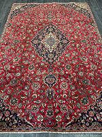 Full view of entire rug showing design and condition