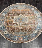 Full overhead view of round oriental rug