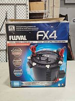 Front of Fluval FX4 box showing model and capacity specs