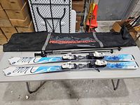 Full set showing skis, bindings, poles and bag
