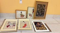Group shot of all framed and unframed Asian prints laid out