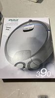 Front of iRobot Scooba 390 retail box showing product image and branding