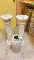 Overall view of two pedestals and floor vase
