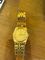 Front view of gold-tone Seiko wristwatch