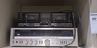 Sony TC-WR730 cassette deck stacked above Sansui 4900Z receiver on shelf