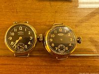 Front view of both watch dials and crowns