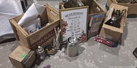 Overall lot view with crates, cookware, framed print, kettle, accessories