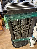 Stacked plastic shelves wrapped together