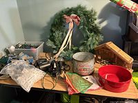 Wreath, lights, bucket, nativity stable, hooks on table