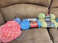 All skeins on chair showing quantity and colors