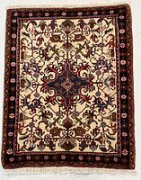 Full view of Heriz rug showing overall design and borders