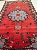 Full view of rug showing overall design, colors and borders