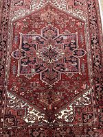 Full view showing entire central medallion and border of the Heriz Serapi rug