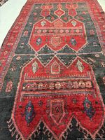 Close-up of upper half detailing motifs and pile