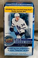 Front view of sealed box showing branding, series, pack and card count details