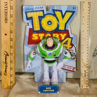 Front view of sealed Buzz Lightyear figure on Toy Story 4 card