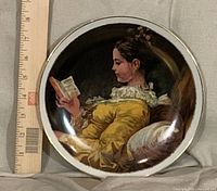 Front view of porcelain plate with ruler for scale