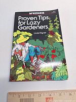 Front cover of paperback book with ruler for scale