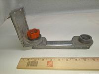 Overall view of Sandvik aluminum miter saw guide next to ruler for scale