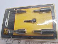 Front of sealed package showing five shaping cutters and branding