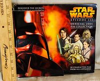 Front of closed display board showing Star Wars branding and characters