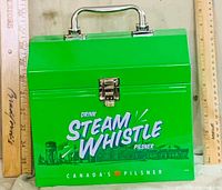 Front view showing Steam Whistle graphics, latch, handle