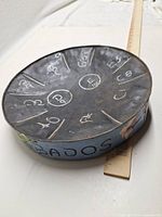 Top view showing segmented playing surface with note labels and painted sidewall