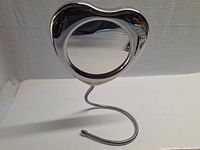 Front view showing heart-shaped dual-sided mirror on gooseneck