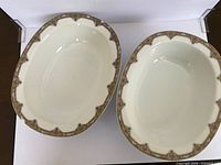 Two 9 in oval serving bowls showing pattern and interior