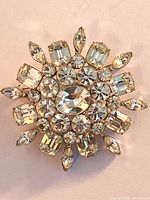 Front view of starburst brooch showing stone arrangement