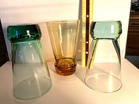 All three colored weighted base glass tumblers with ruler for scale