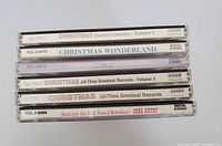 Stack of five Christmas-themed CDs