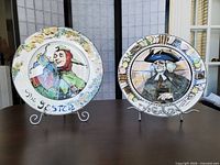 The Jester and The Parson plates on stands