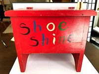 Front view showing multicolour “shoe shine” text and overall box shape