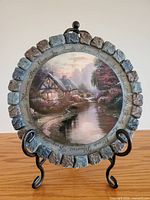 Front view showing full artwork and stone-look border