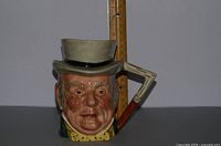 Front view of Mr. John Bull toby jug with ruler for height reference