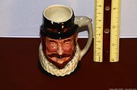 Front view of Sir Walter Raleigh jug beside ruler showing ~3 in. height