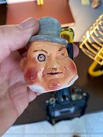 Close-up of Algy jug showing face and handle