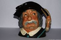 Front view Sancho Panza Toby Jug showing facial detail and donkey handle