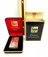 Forum Electronic Crown lighter presented in open black case beside branded outer box